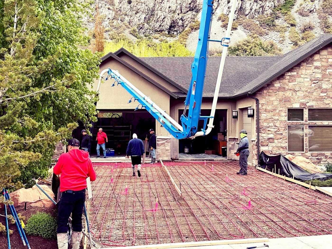 Concrete boom pump placing concrete for a Utah residential project